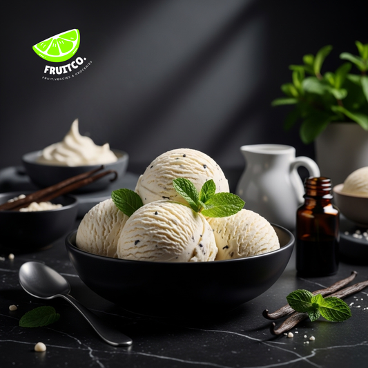 Bowl of creamy vanilla ice cream scoops with fresh mint leaves